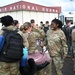 Returning deployers are welcomed home by friends and family