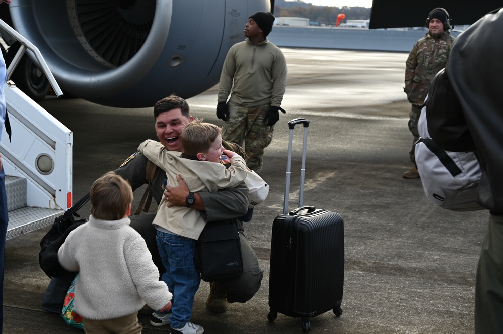 Returning deployers are welcomed home by friends and family