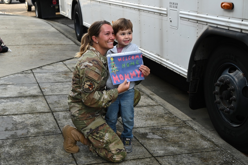 Returning deployers are welcomed home by friends and family