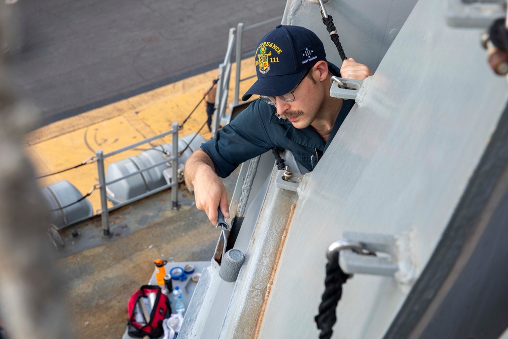 USS Spruance Sailors conduct paint preservation