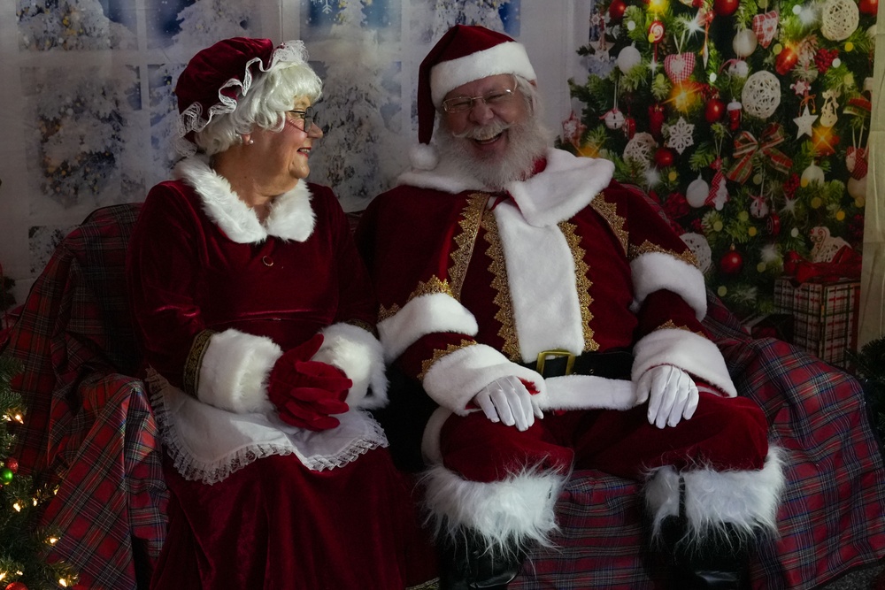 Santa Clause shares a laugh with his spouse, Mrs. Clause