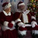 Santa Clause shares a laugh with his spouse, Mrs. Clause