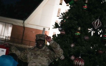 Col. Deedrick Reese, Robins Installation and 78th Air Base Wing commander, orders the countdown Team Robins children before flipping the switch to light the base tree.