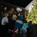 Col. Deedrick Reese, Robins Installation and 78th Air Base Wing commander, along with Team Robins children, illuminate the base tree.