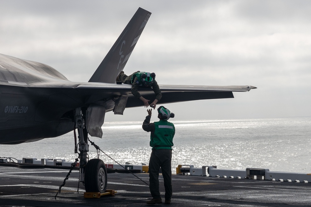 Steel Knight 24: VMFA-211 performs maintenance on the flight deck