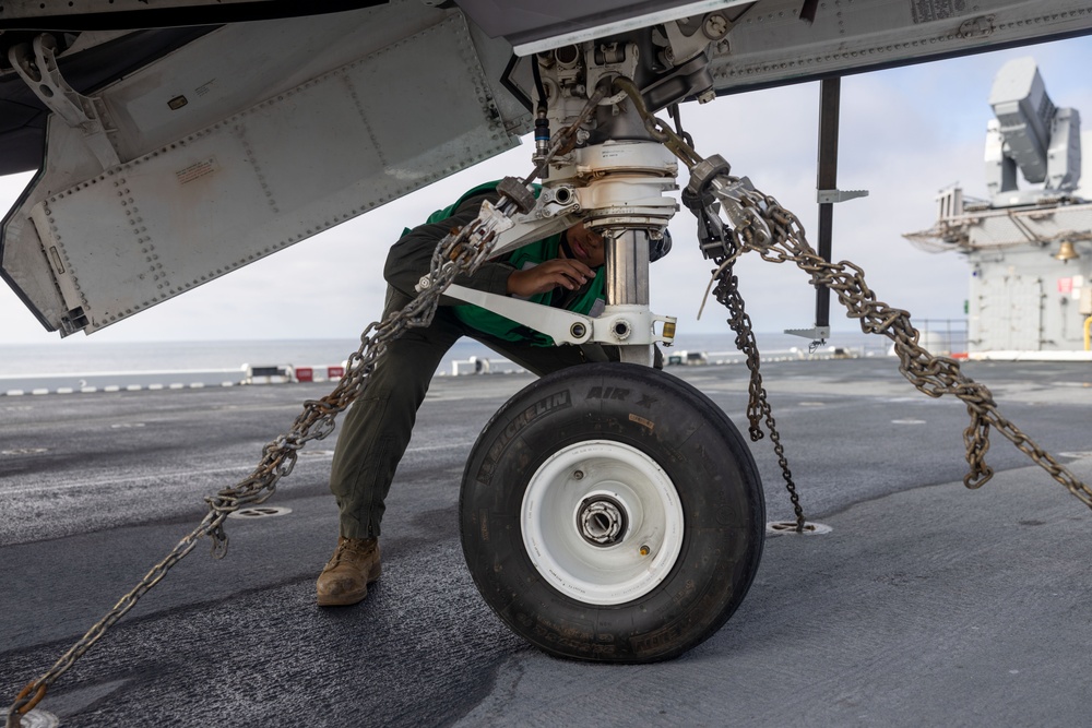 Steel Knight 24: VMFA-211 performs maintenance on the flight deck
