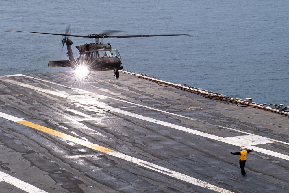 USS Ronald Reagan (CVN 76) conducts joint flight deck operations with the U.S. Army