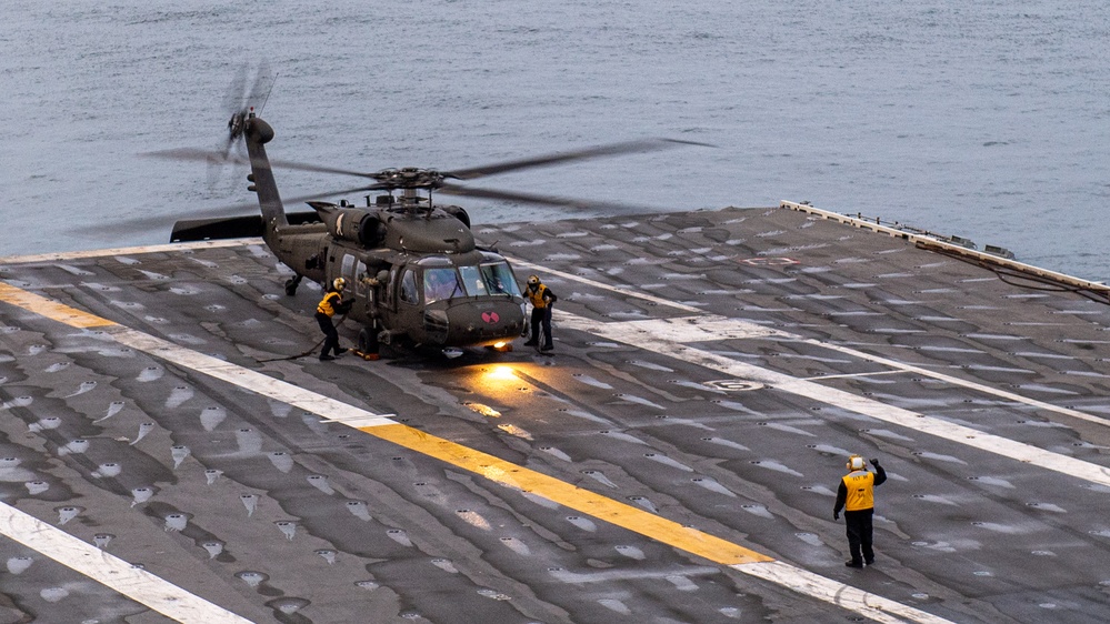 USS Ronald Reagan (CVN 76) conducts joint flight deck operations with the U.S. Army