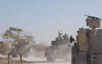 Coalition Forces Depart in a Bradley Fighting Vehicle Convoy in Syria