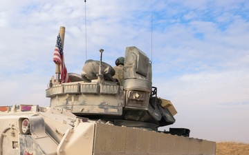 Coalition Forces Secure Perimeter with M2A3 Bradley Fighting Vehicles