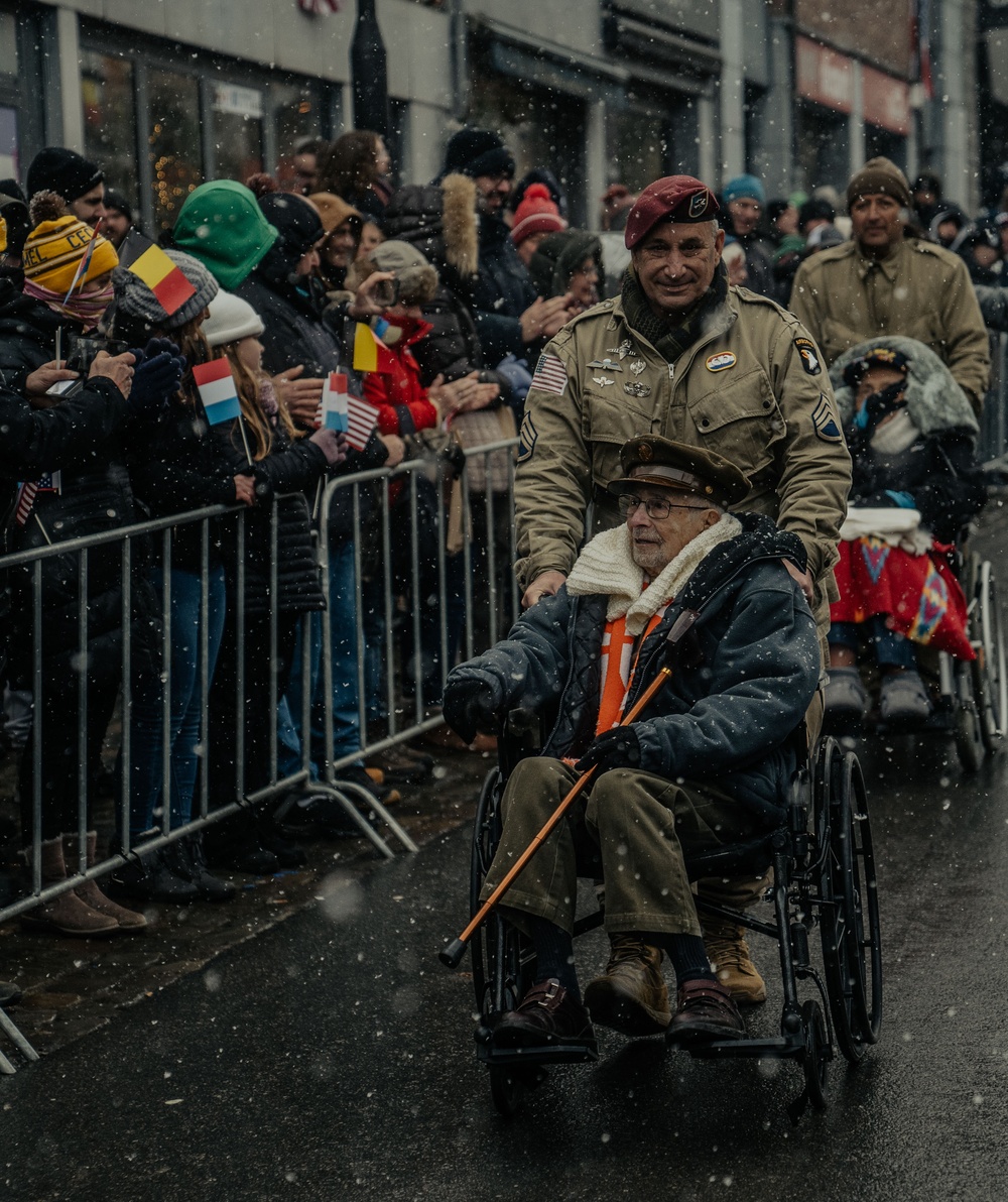 Screaming Eagle Soldiers March In NUTS! Parade With World War II Veterans