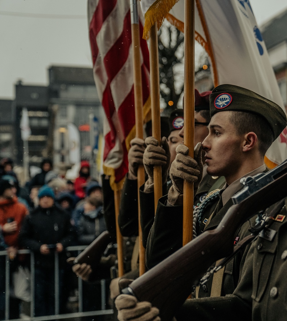 Screaming Eagle Soldiers March In NUTS! Parade With World War II Veterans