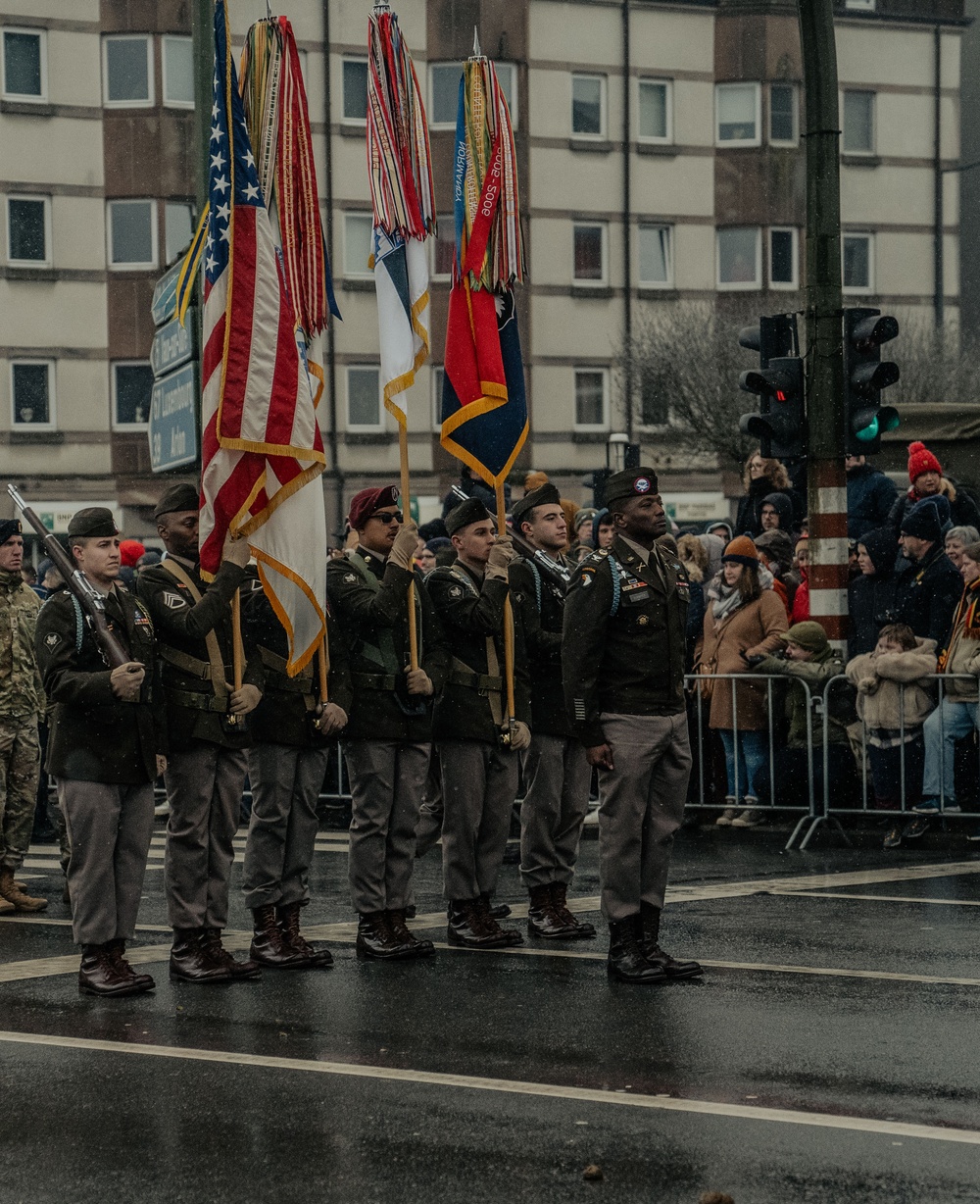 Screaming Eagle Soldiers March In NUTS! Parade With World War II Veterans