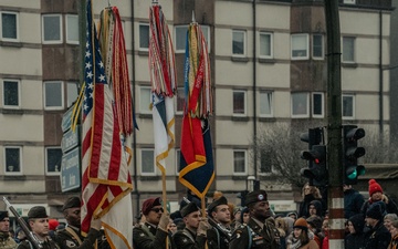 Screaming Eagle Soldiers March In NUTS! Parade With World War II Veterans