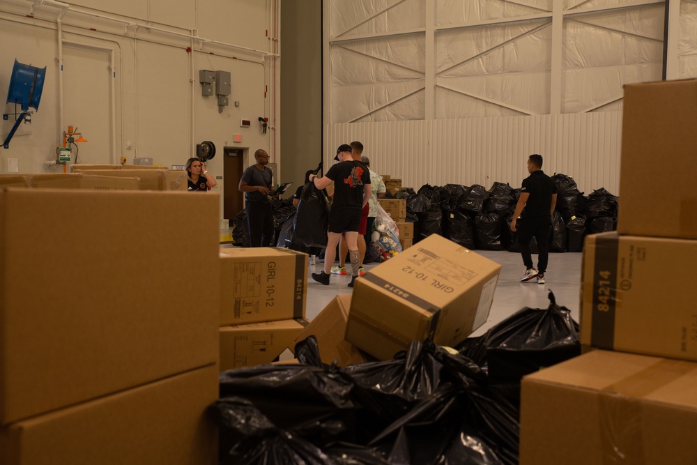 Camp Blaz Marines load toys for Toys for Tots