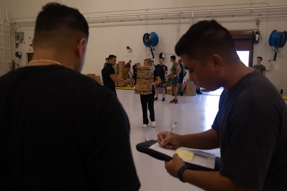 Camp Blaz Marines load toys for Toys for Tots