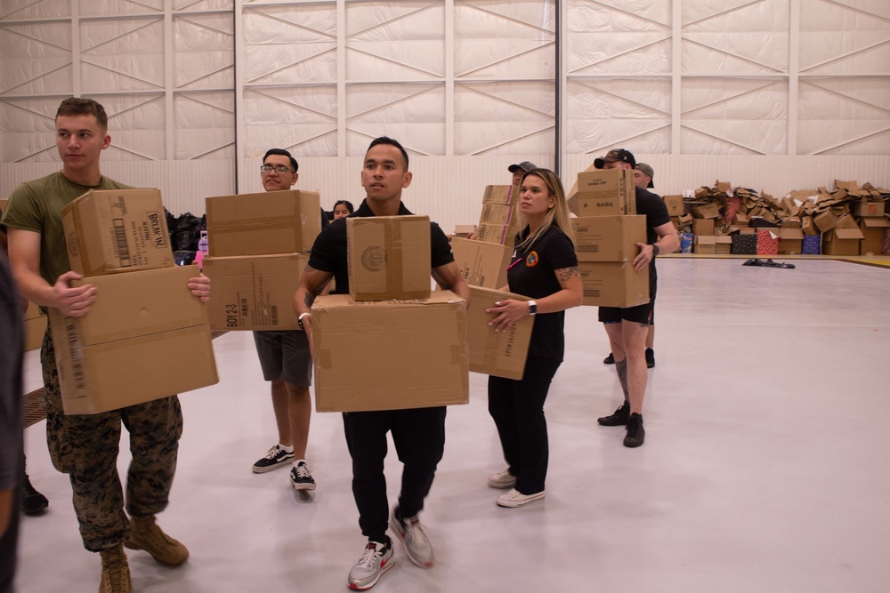 Camp Blaz Marines load toys for Toys for Tots