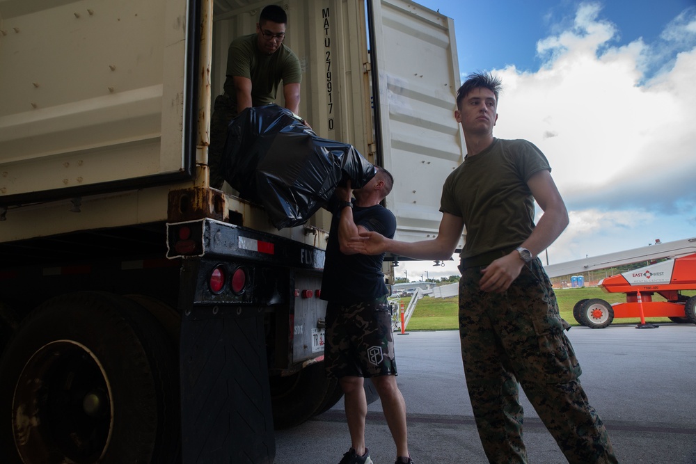 Camp Blaz Marines load toys for Toys for Tots