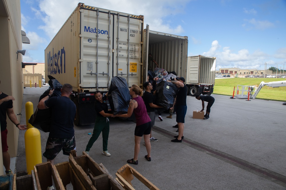 Camp Blaz Marines load toys for Toys for Tots