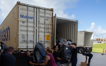 Camp Blaz Marines load toys for Toys for Tots