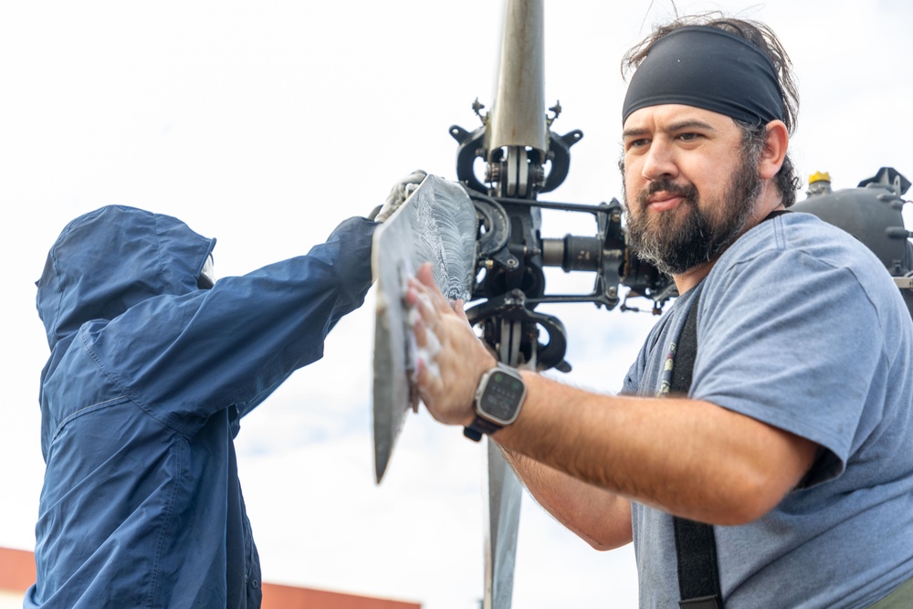 Marines, contractors clean MAG-36 aircraft