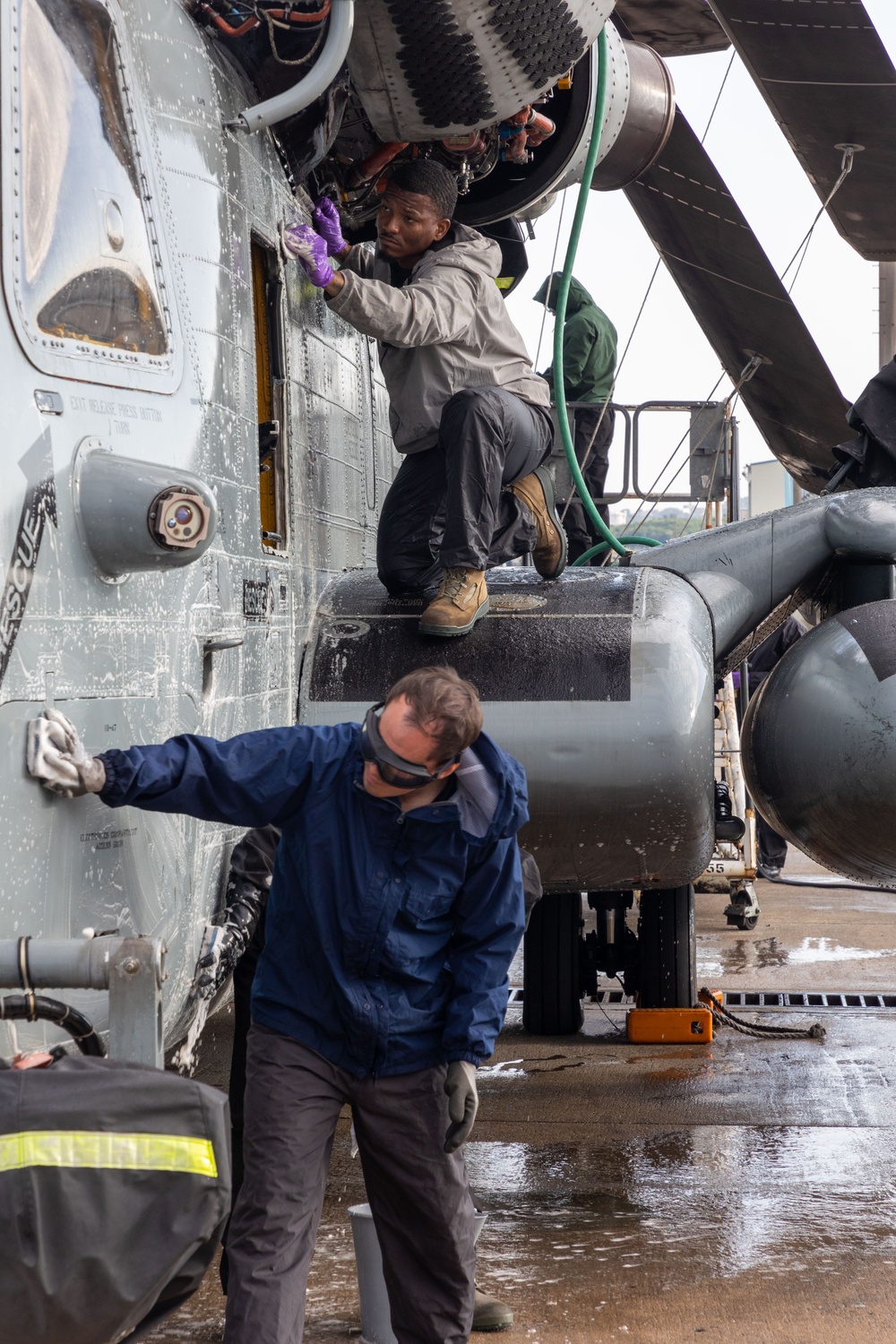 Marines, contractors clean MAG-36 aircraft