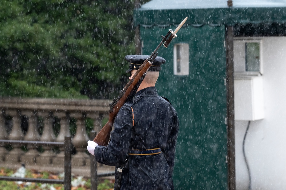 Tomb Guard Walks the Mat in the Rain