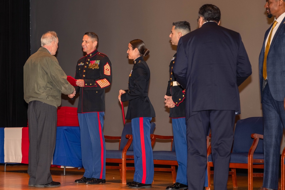 Former Marine Security Guards are awarded by the Sergeant Major of the Marine Corps