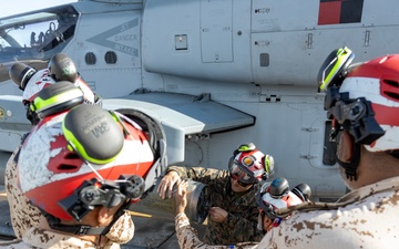 U.S. Marines with HMLA-167 welcome Royal Bahraini Air Force personnel