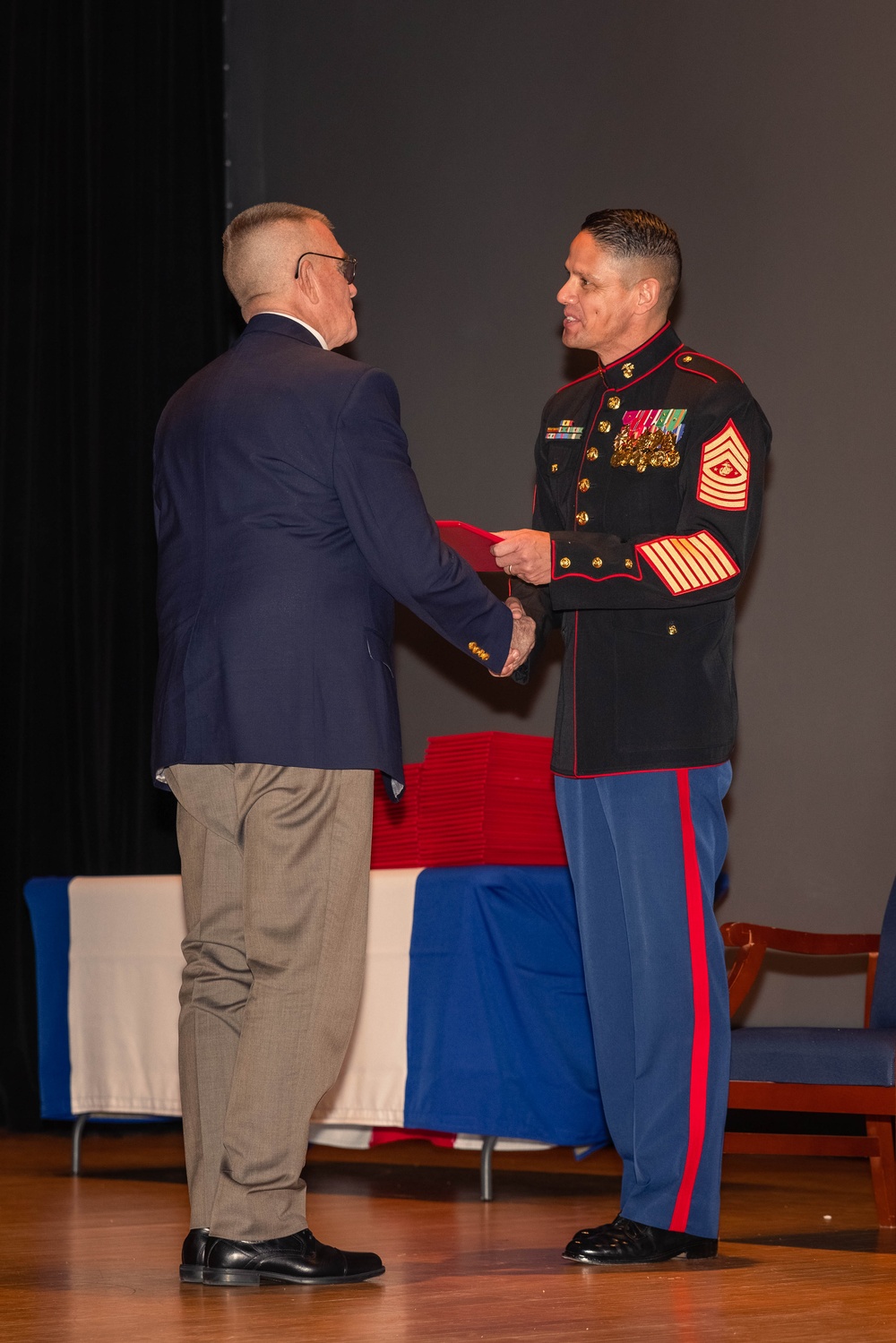 Former Marine Security Guards are awarded by the Sergeant Major of the Marine Corps