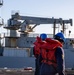 USS Abraham Lincoln conducts ammunition transfer with USNS Washington Chambers