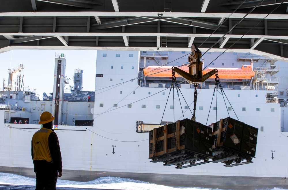 USS Abraham Lincoln conducts ammunition transfer with USNS Washington Chambers