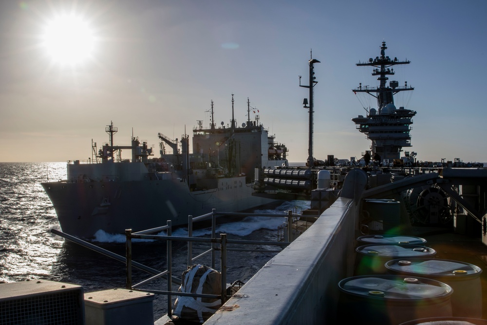 USS Abraham Lincoln conducts ammunition transfer with USNS Washington Chambers