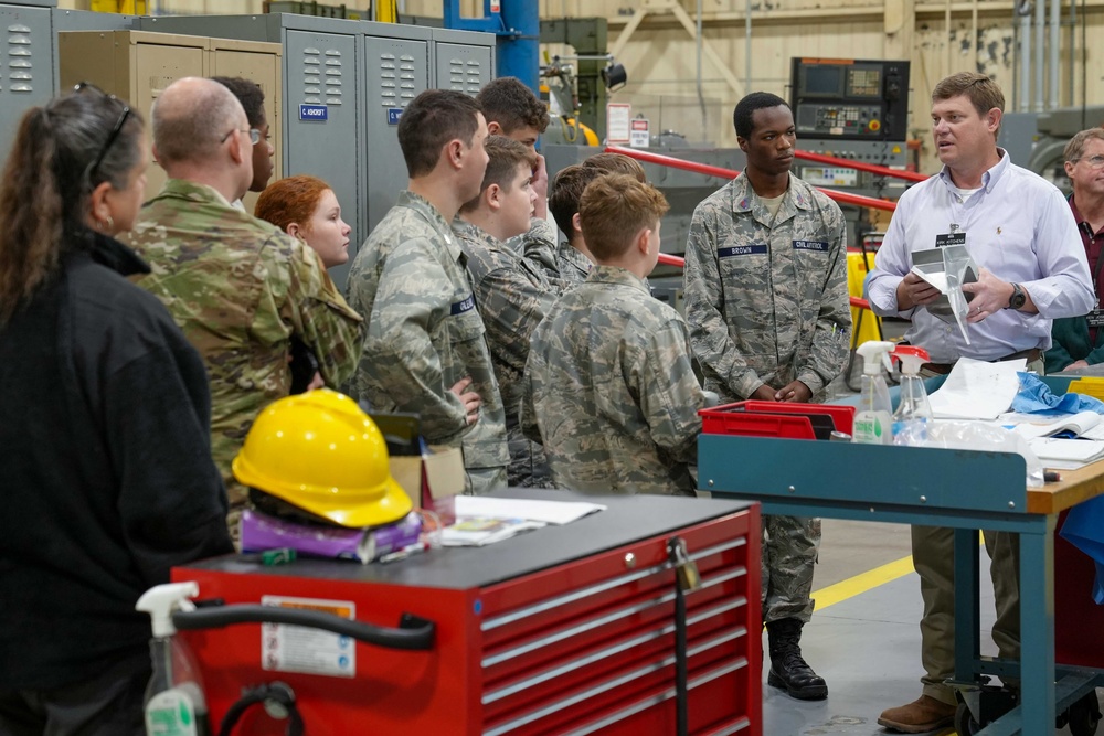 Kirk Kitchens, 573rd Manufacturing Squadron Machine Shop flight chief, explains 3-D printing techniques and their uses in depot level aircraft maintenance to members of the Civil Air Patrol