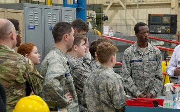 Kirk Kitchens, 573rd Manufacturing Squadron Machine Shop flight chief, explains 3-D printing techniques and their uses in depot level aircraft maintenance to members of the Civil Air Patrol