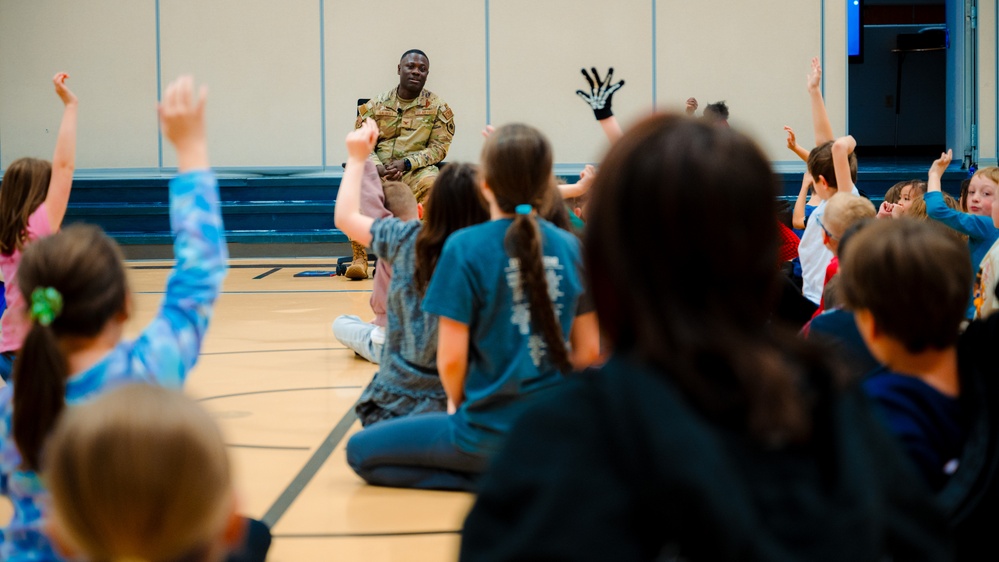 Col. Galbert reads to Freedom Elementary students