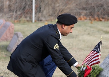 Army Reserve Soldiers lay wreaths for veterans dating back to the Revolutionary War