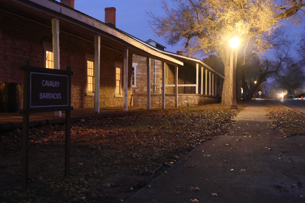 Candlelight Stroll visitors stop at Cavalry Barracks