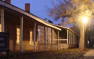 Candlelight Stroll visitors stop at Cavalry Barracks