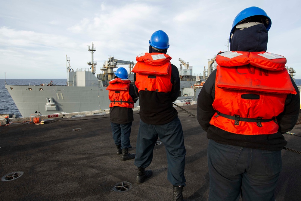 USS Abraham Lincoln conducts ammunition transfer with USNS Washington Chambers