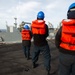 USS Abraham Lincoln conducts ammunition transfer with USNS Washington Chambers