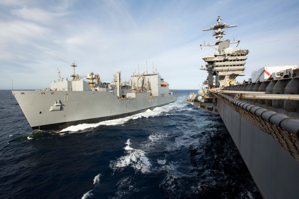 USS Abraham Lincoln conducts ammunition transfer with USNS Washington Chambers