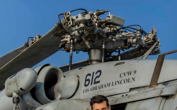 Commanding officer of Helicopter Sea Combat Squadron (HSC) 14 poses for an environmental portrait