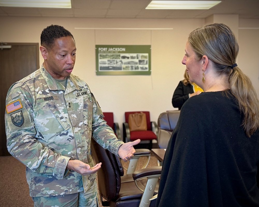 Maj. Gen. Daryl Hood coins DoDEA Director Dr. Beth Schiavino-Narvaez