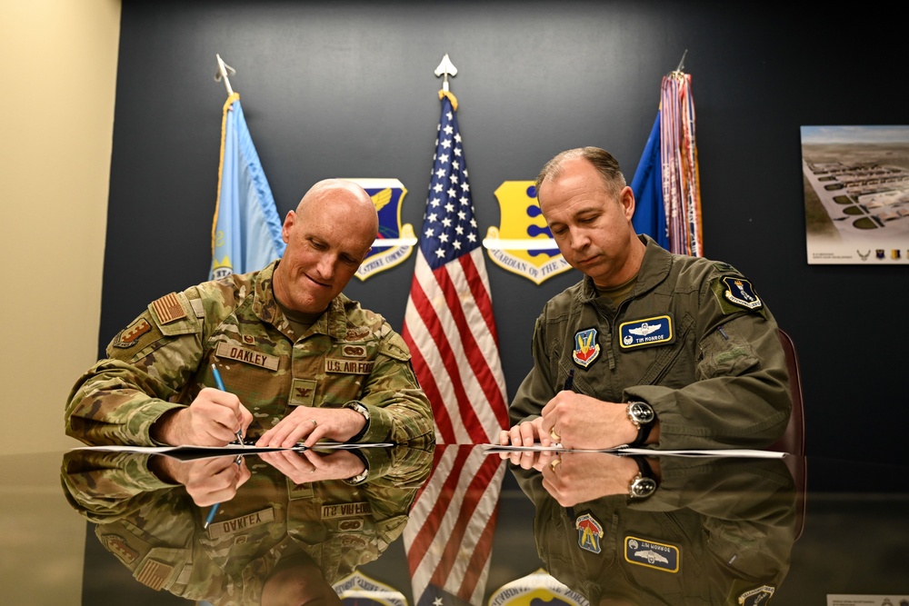 28th Bomb Wing Commander and 319th Reconnaissance Wing Commander Sign MOA