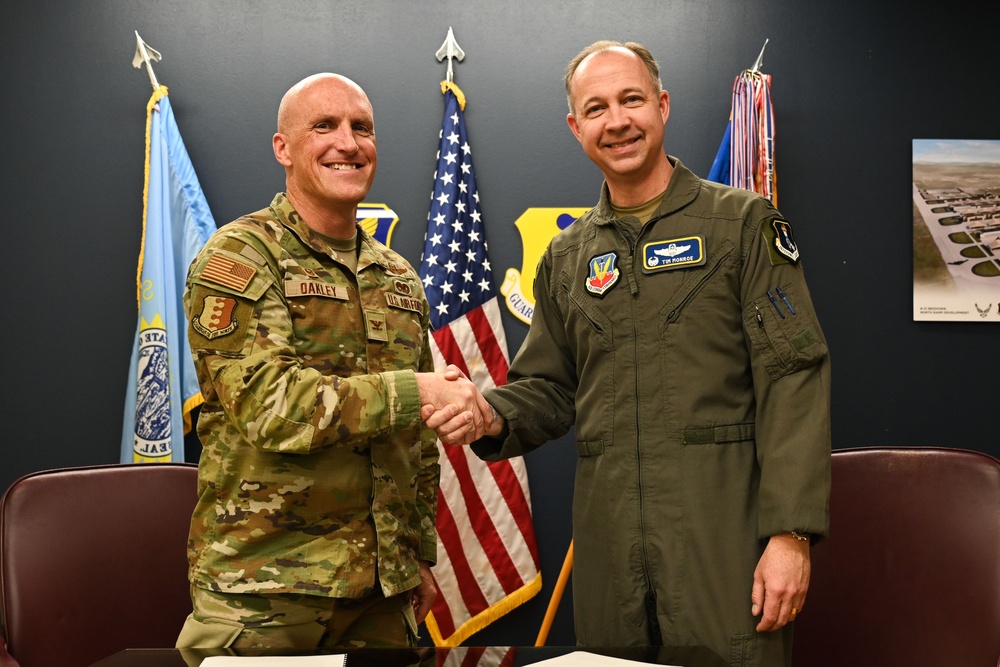 28th Bomb Wing Commander and 319th Reconnaissance Wing Commander Sign MOA