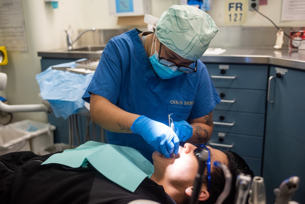 USS Ronald Reagan (CVN 76) Sailors perform dental cleaning