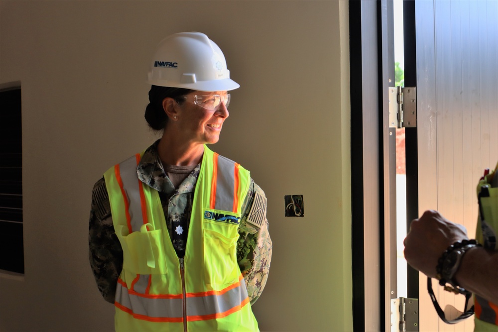 Commander Jamie Rivas conducts a site tour of an active construction project