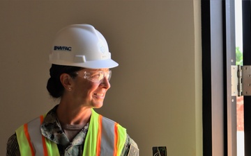 Commander Jamie Rivas conducts a site tour of an active construction project