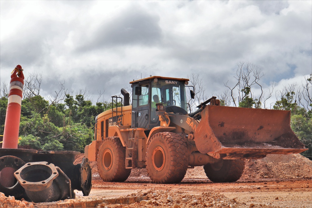 A  wheel loader returns for another load of dirt on the site of an active construction project